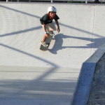 Jose Castillo, young skater, drops in half-pipe at Westwind Lakes skatepark Miami