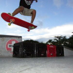 Jose Castillo, young skater, ollies over 4 crates at Westwind Lakes Skatepark Miami