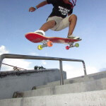 Jose Castillo, young skater, ollies a 4-stair at Westwind Lakes skatepark Miami